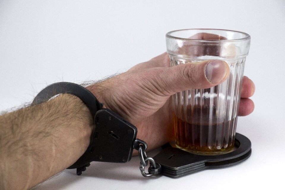 Handcuffs drinks liquor