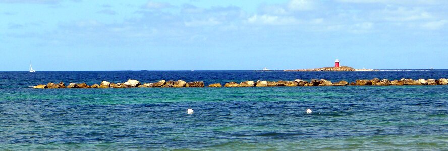 Lighthouse rocks summer photo