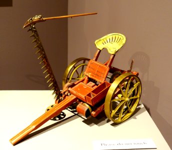 Mowing machine, salesman's sample, made by Walter A. Wood's Mowing and Reaping Machine Company, Hoosick Falls NY, c. 1880, wood, brass, cast iron, painted - Bennington Museum - Bennington, VT - DSC09130 photo