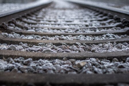 Train tracks railway rails seemed bedded photo