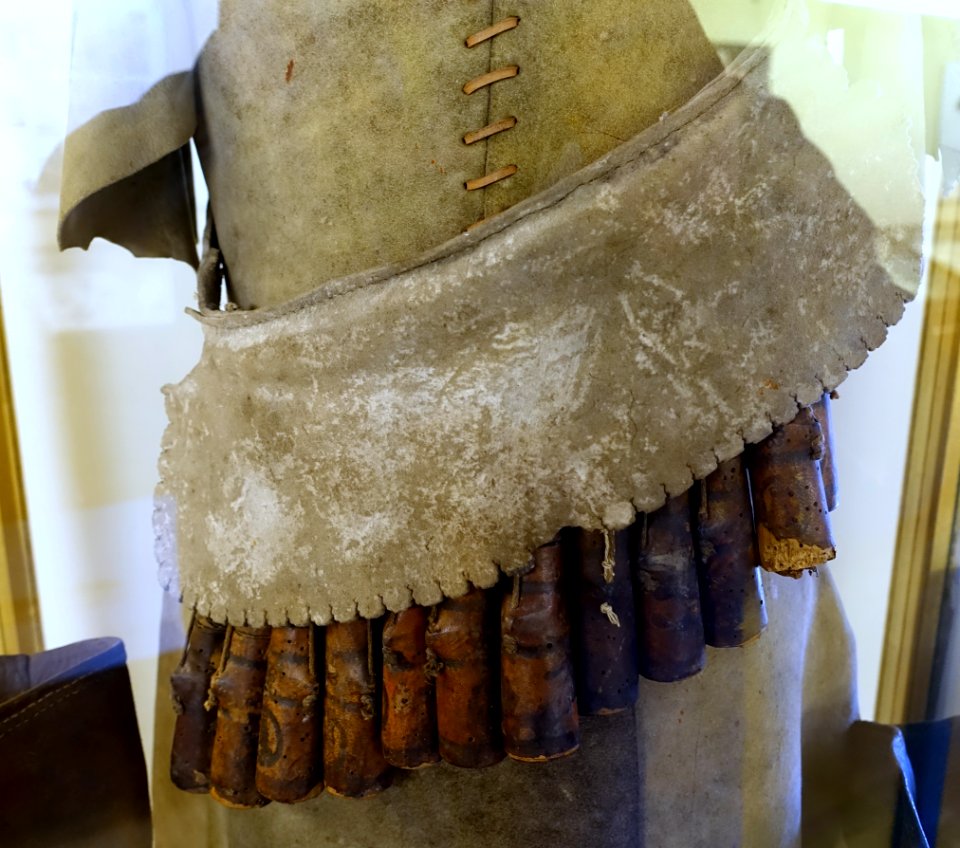 Musketeers' Bandolier or Cartridge Baldric, time of Charles I and the Civil War, leather, iron rings, wooden charge cases - Museum, Haddon Hall - Bakewell, Derbyshire, England - DSC02964