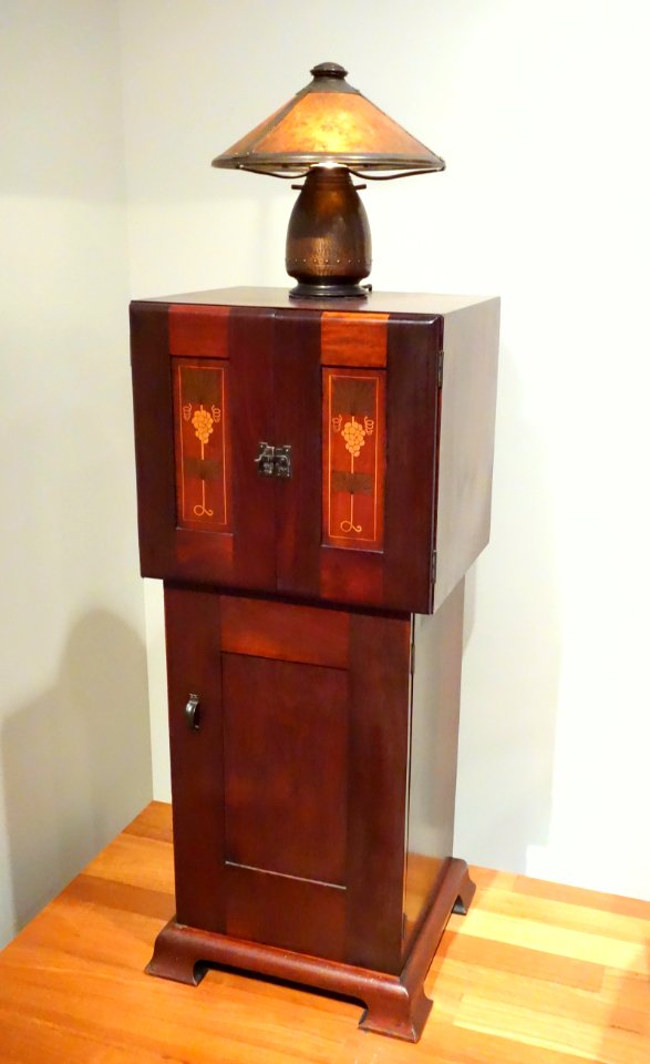 Music cabinet designed by Harvey Ellis, made by Craftsman Workshops, c. 1903, mahogany with maple inlay, and Lamp, designed by Frederick Theodore Brosi, c. 1922-1925 - De Young Museum - DSC00716