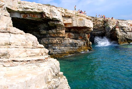 People jumping water photo