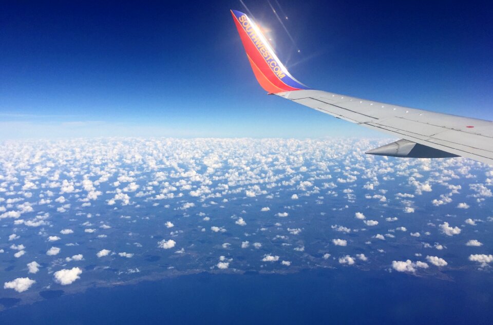 Clouds sky blue airplane