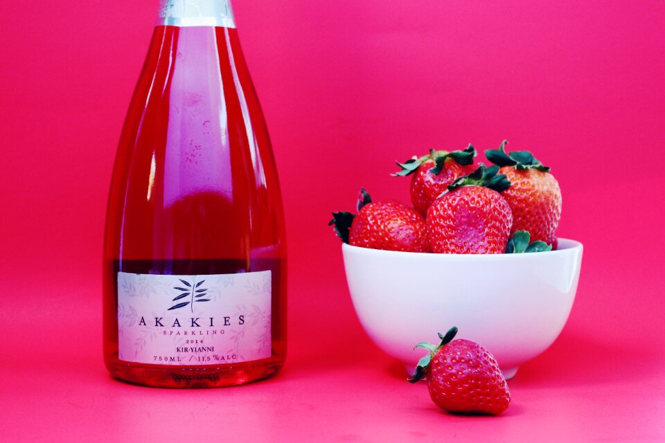 Wine bottle sparkling rose berries