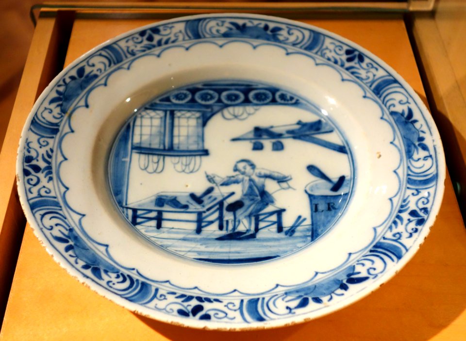 Netherlands plate depicting shoemaker in shop, Delftware, 17th century - Bata Shoe Museum - DSC00284