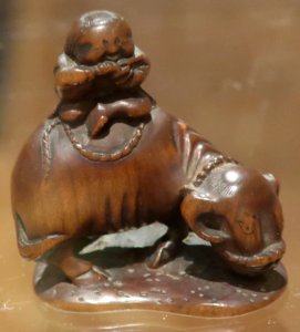 Netsuke with boy riding an ox, 18th century, wood, Honolulu Museum of Art