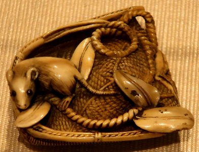 Netsuke with rat in a basket, Meji period, ivory, Honolulu Museum of Art