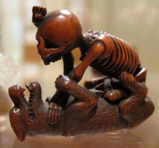 Netsuke with Onna no Komachi and Fukusa Shoso depicted as wolf and skeleton