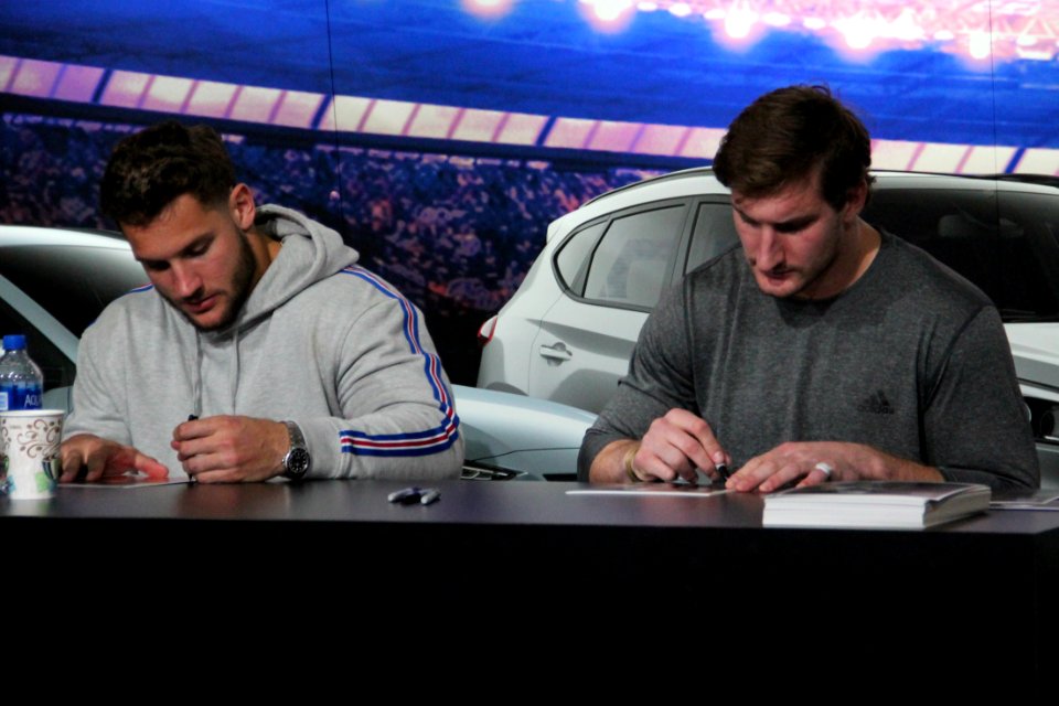 Nick and Joey Bosa signing autographs, Jan 2019