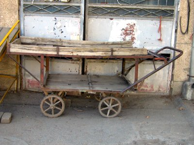 Old wooden cart - front of a garage door - 17 st - Nishapur