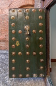 Old wooden door parador Granada Spain