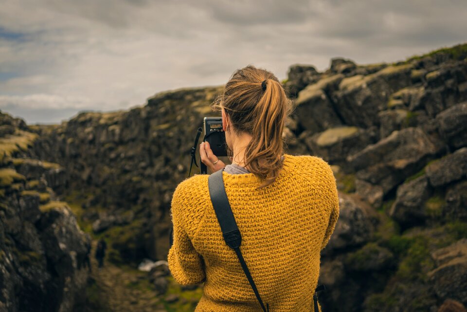 Rocky taking photo woman