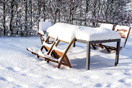 Wood chairs metal table snowy