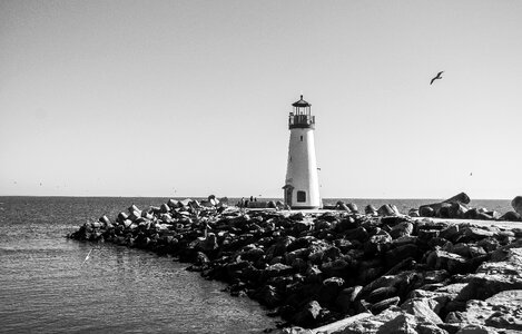 Rocks lighthouse shore photo