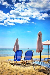 Vacations sun loungers sand beach photo