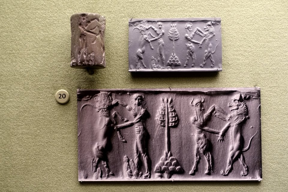 Nude bearded hero wrestling with water buffalo, bull man fighting lion, Mesopotamia, Akkadian period, c. 2334-2154 BC, serpentine cylinder seal - Morgan Library & Museum - New York City - DSC06594