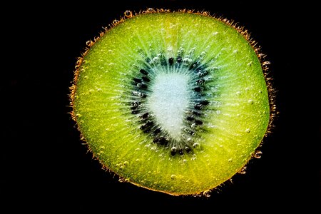 Slice kiwi in the water water photo