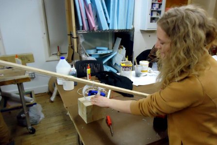 NYU student works on Rube-Goldberg part at Tisch Ctr for Arts