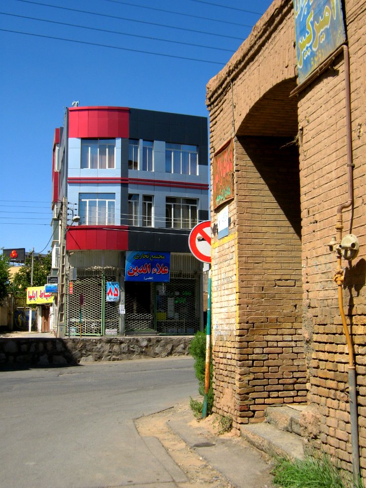Old brick made house and new aluminium front building - Manuchehri st - Nishapur 4