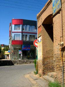 Old brick made house and new aluminium front building - Manuchehri st - Nishapur 4