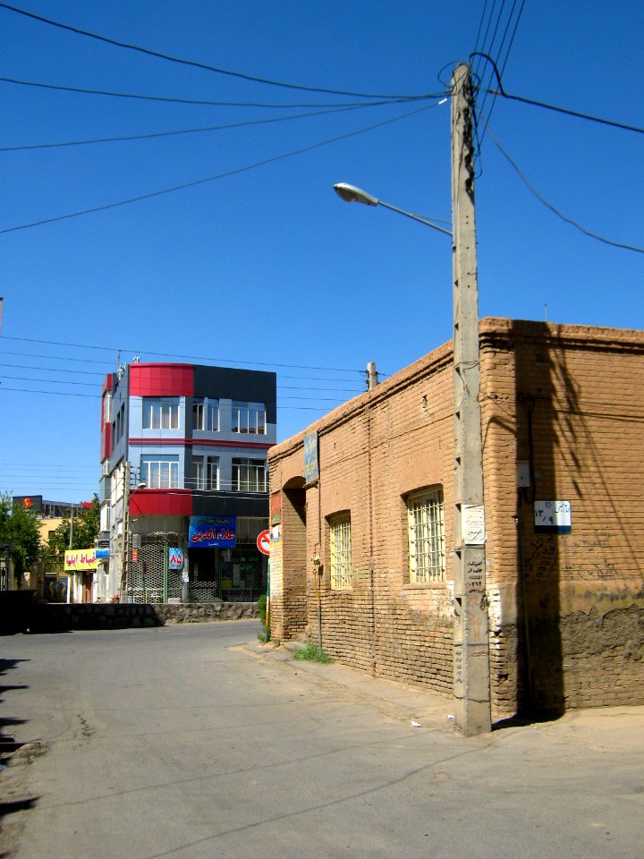Old brick made house and new aluminium front building - Manuchehri st - Nishapur 5