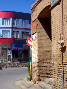Old brick made house and new aluminium front building - Manuchehri st - Nishapur 1