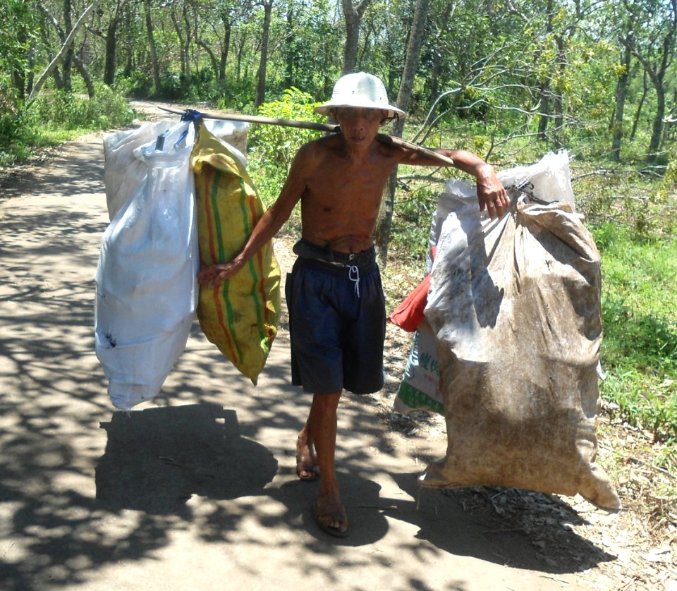 Old man with carrying pole