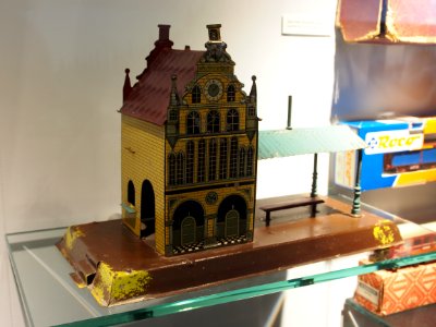 Old tin toy bus-train station