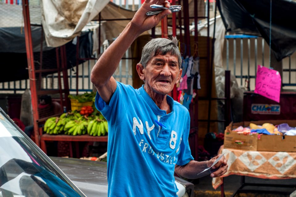 Old man with a hole opens in his hand