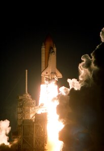 Night launch pad rocket boosters photo