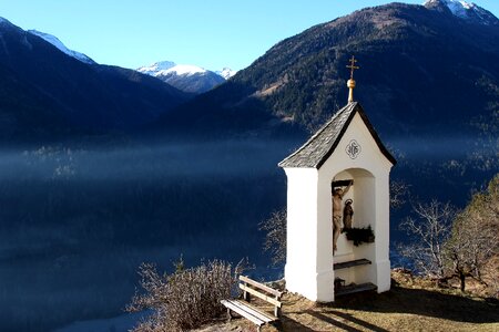 Mountains snow small chapel