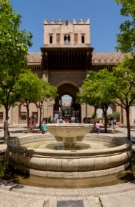 Orange trees courtyard fountain cathedral Puerta del Perdon Seville Spain