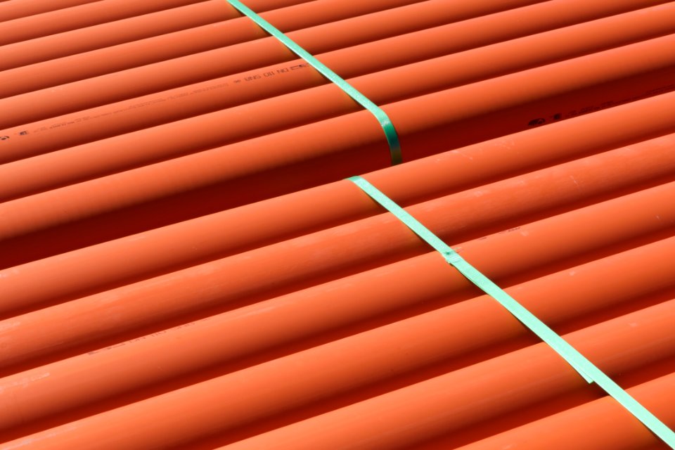 Orange plastic pipes