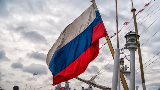 Boat waving flag sailing ship