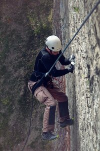 Mountain climbing rappelling sport photo