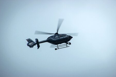 Police helicopter monitoring flying photo