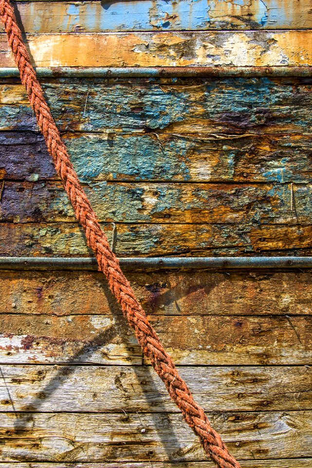 Peeling paint old wood rope