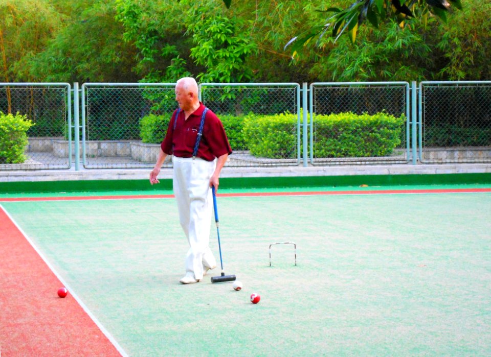 People playing gateball or a variant in Haikou People's Park - 04
