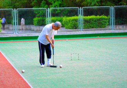 People playing gateball or a variant in Haikou People's Park - 03 photo