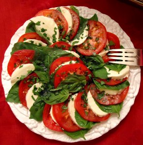 Party food dish 8 salad tomatoes cheese lettuce spinach photo