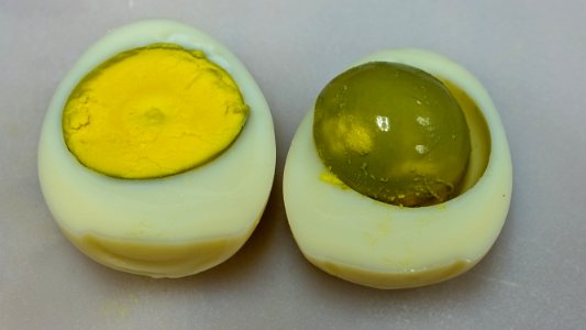 Overcooked hardboiled egg cut in half
