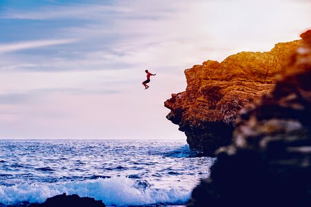 Waves man cliff diving