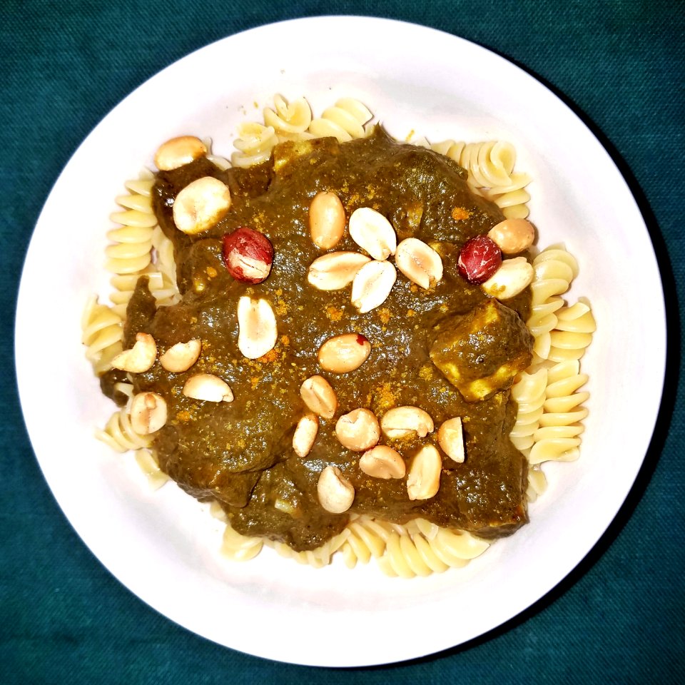 Palak paneer on rotini, with curry powder and peanuts - Massachusetts