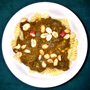 Palak paneer on rotini, with curry powder and peanuts - Massachusetts
