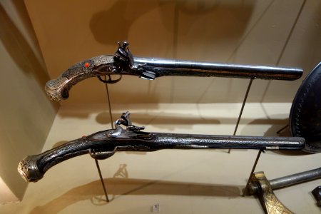Pair of flintlock pistols, Turkey, late 18th to early 19th century, wood inlaid with silver wire and corla, overlaid with chased silver plaques - Huntington Museum of Art - DSC04935