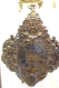 Plate clock (Telleruhr), probably Germany, c. 1700, repousse zinc-plated copper sheet with pewter numerals - Nordiska museet - Stockholm, Sweden - DSC09962