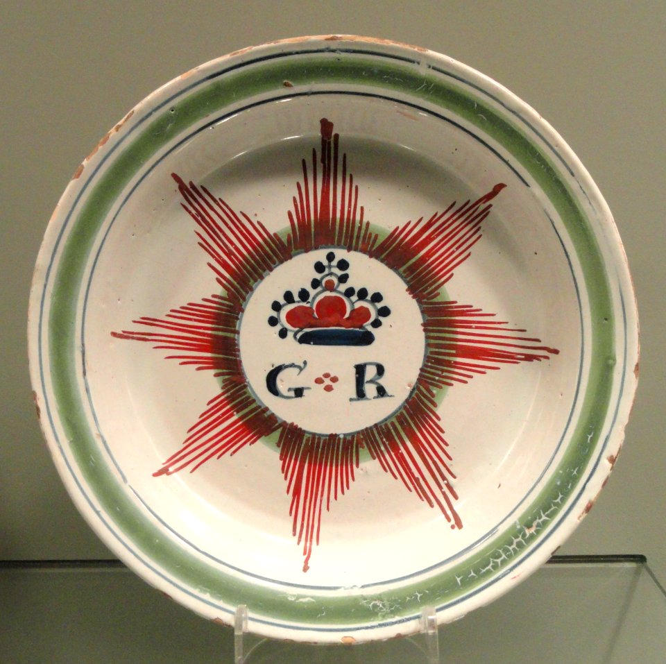 Plate commemorating George I, c. 1714-1727, probably Bristol, tin-glazed earthenware - Gardiner Museum, Toronto - DSC01266
