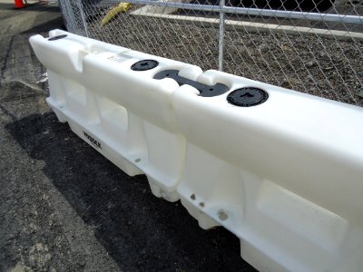 Plastic road barriers can be connected filled with water emptied
