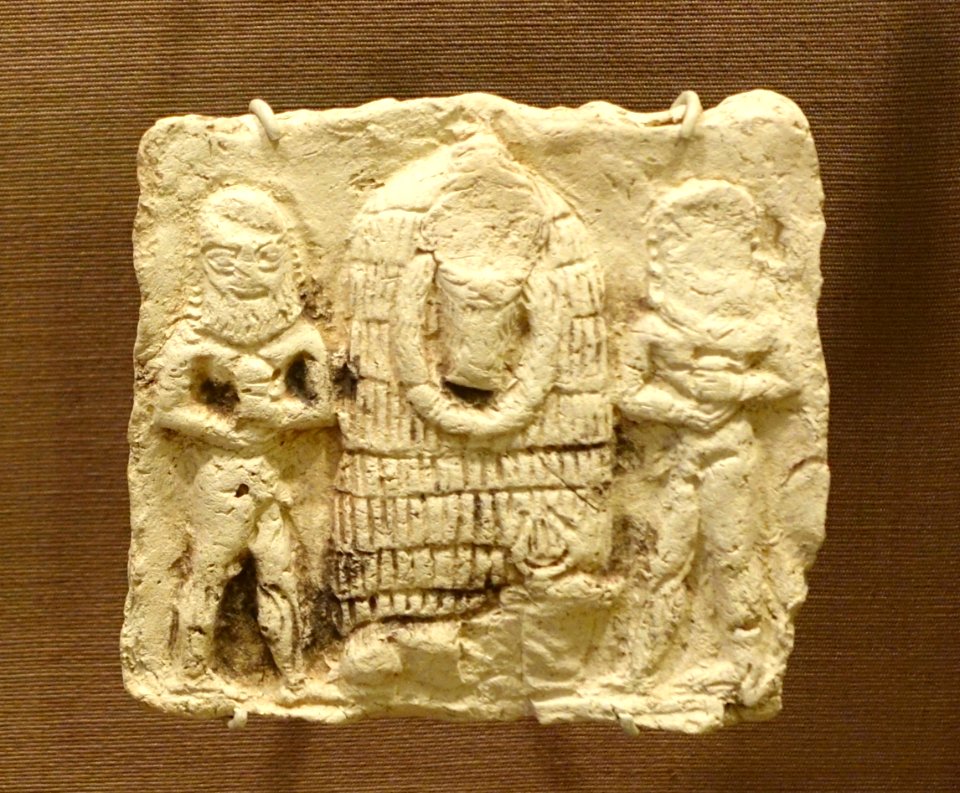 Plaque of unidentified god with two nude men, Iraq, Isin-Larsa to Old Babylonian, 2000-1600 BC, baked clay - Oriental Institute Museum, University of Chicago - DSC07410